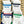 Four pairs of white socks with colored stripes and 'Dallas' and 'Texan' text on a branded background