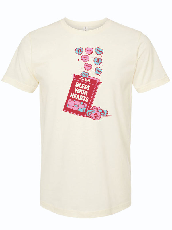 Cream t-shirt with a graphic design of a box of candy hearts and text reading Bless Your Hearts