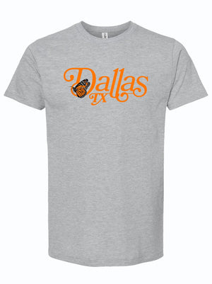 The Butterfly Dallas t-shirt features a stylish design with a butterfly and 'Dallas TX' text in vibrant orange on a soft gray fabric. Ideal for showcasing your Texas pride, this shirt makes a perfect Texas themed gift, perfect as a Texas Made Gift, a souvenir from Texas, or a dallas souvenir for anyone looking to celebrate Texan culture.