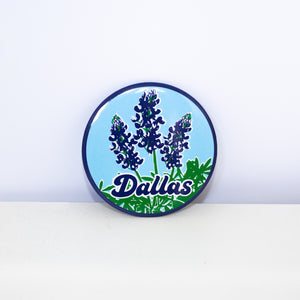 Circular, light blue magnet with Bluebonnets design.