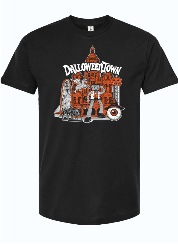 A stylish black unisex fine jersey tee featuring a vibrant illustration of Dalloweentown with playful Halloween motifs. Perfect as a Texas themed gift, it's a unique piece among Texas Made Gifts and makes for an excellent souvenir from Texas, ideal for those looking for a standout dallas souvenir or any Texan gifts.