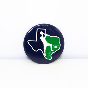 Circular, navy magnet with GOAT design.