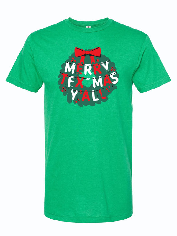 Merry Tex-Mas Y'all graphic t-shirt featuring a festive wreath design, perfect for the holidays. This vibrant green tee is an ideal Texas themed gift, showcasing the spirit of Texas with a playful twist. Great for adding to your collection of Texas Made Gifts or as a fun souvenir from Texas, especially for anyone in Dallas looking for unique Texan gifts.
