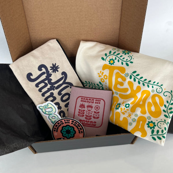 Mother's Day Gift Box featuring a Bullzerk Texas Mama t-shirt and an assortment of Dallas and Texas-themed small products. 
