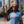 Woman in sunglasses and the Bullzerk Neon Dallas tshirt standing outside in downtown Dallas. 