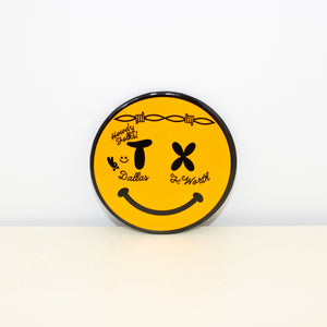 Circular, black and yellow magnet with Smiley Face design.