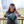 Woman wearing a Bullzerk Texas Silhouette tshirt standing outside. 