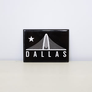 Rectangular, black magnet with Trinity design.