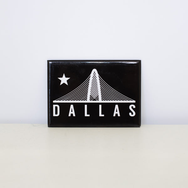 Rectangular, black magnet with Trinity design.