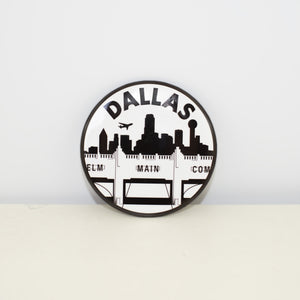 Circular, black and white magnet with Triple Underpass design.