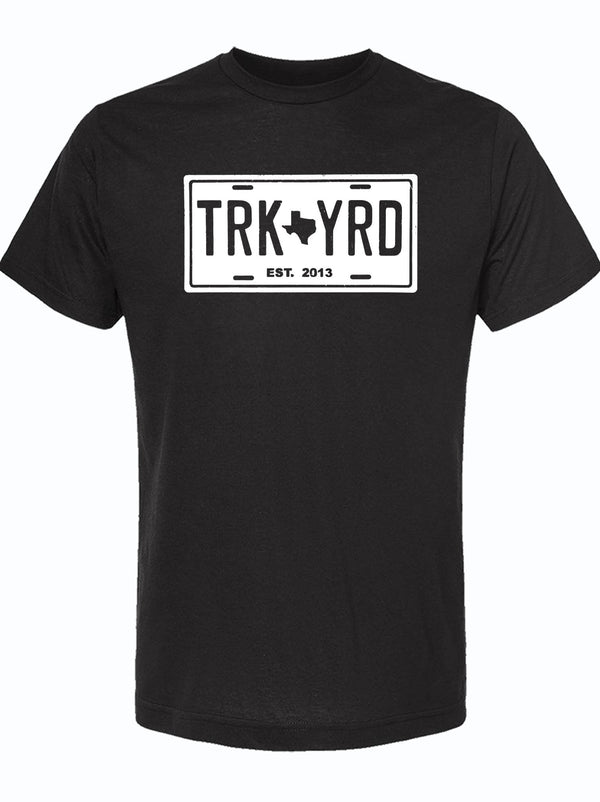 Truck Yard License Plate design on a black unisex fine jersey tee, perfect for showcasing Texas pride. A great Texas themed gift, this shirt makes an ideal choice for souvenirs from Texas, especially for fans of Dallas. Celebrate your love for the Lone Star State with this stylish Texan gift.