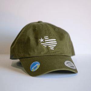 Embroidered Texas Silhouette Hat - Olive, featuring a stylish embroidered Texas design, perfect for showcasing Texas pride. Ideal as a Texas themed gift, this cap fits well into the range of Texas Made Gifts, offering a unique option for souvenirs from Texas, making it a great Dallas souvenir or Texan gift.