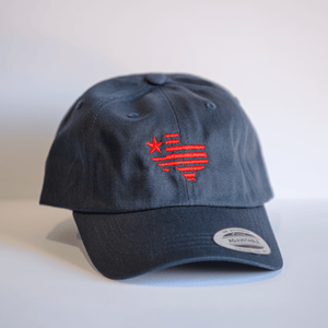 Embroidered Texas Silhouette Hat - Navy featuring a red Texas outline design, perfect as a Texas themed gift. This stylish cotton hat makes for a great souvenir from Texas and is ideal for anyone looking for unique Texas Made Gifts, especially for Dallas souvenir hunters and fans of Texan gifts.