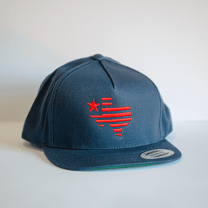 Embroidered Texas Silhouette Flatbill Hat in navy color, featuring a stylish design with red stripes and a star, perfect for showcasing Texas pride. An ideal Texas themed gift, this hat makes a great Texas Made Gift, and is a must-have souvenir from Texas for fans and tourists. A great choice for dallas souvenir shoppers and anyone looking for unique texan gifts.