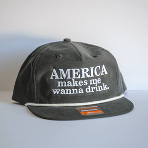Embroidered America Makes Me Wanna Drink Hat - Gray, perfect for showcasing Texas pride. This stylish cap features a fun slogan ideal for Texas themed gift occasions, making it a great pick for souvenirs from Texas. A must-have accessory for those who love the Lone Star State, this hat fits well in any collection of dallas souvenirs or texan gifts.