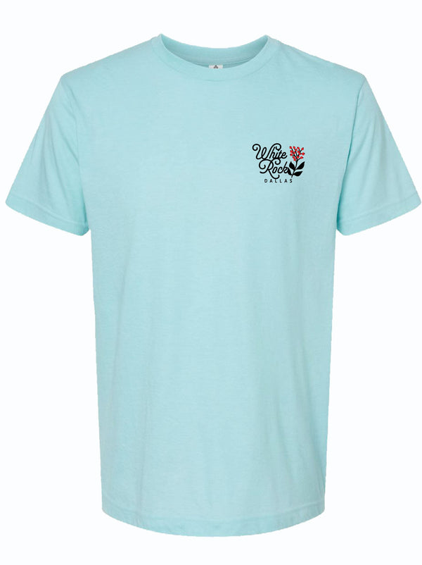 Front view of a light blue tshirt with a graphic design of a flower next to text reading "White Rock Dallas" in black letters. 