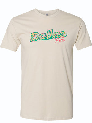 natural colored tshirt with hand-drawn design of the word Dallas covered in wildflowers
