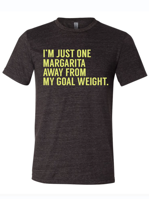 Stylish unisex tri-blend t-shirt featuring the catchy phrase "I'm just one margarita away from my goal weight." A perfect Texas themed gift for anyone with a sense of humor, this shirt embodies the essence of Texas Made Gifts and makes for a great souvenir from Texas, especially as a delightful Dallas souvenir or unique Texan gift.